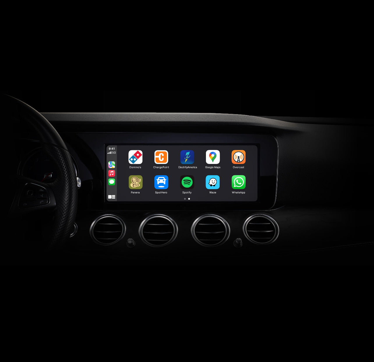 Car dashboard with a touchscreen display showing app icons on a black background